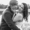 Couple embracing; man kisses woman's cheek.
